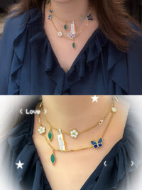 Shop the Lucky Spring motif necklace featuring luminous MOP blossoms, a vibrant blue lapis lazuli butterfly, and malachite leaves set in a gold chain. Elegant nature-inspired design perfect for luxury everyday wear or special occasion gifting.