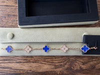 18k gold Vintage VCA Vintage Alhambra Bracelet three deep blue lapis lazuli motifs, accented by two diamond-set