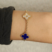 18k gold Vintage VCA Vintage Alhambra Bracelet three deep blue lapis lazuli motifs, accented by two diamond-set